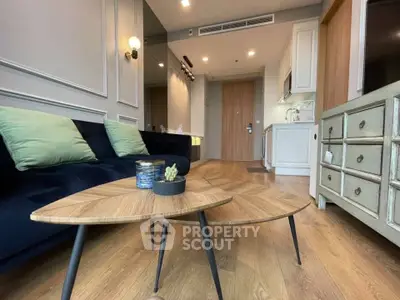 Modern living room with stylish furniture and wooden flooring in a contemporary apartment.