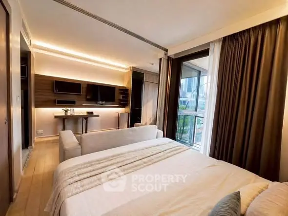 Luxurious bedroom with modern decor and large windows offering stunning city views.