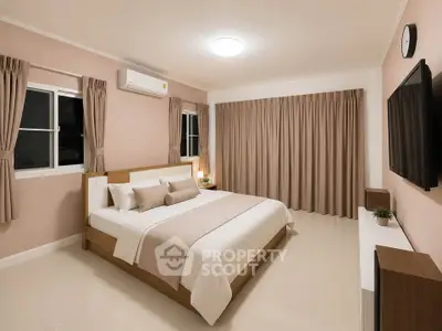 Spacious modern bedroom with elegant decor and natural light