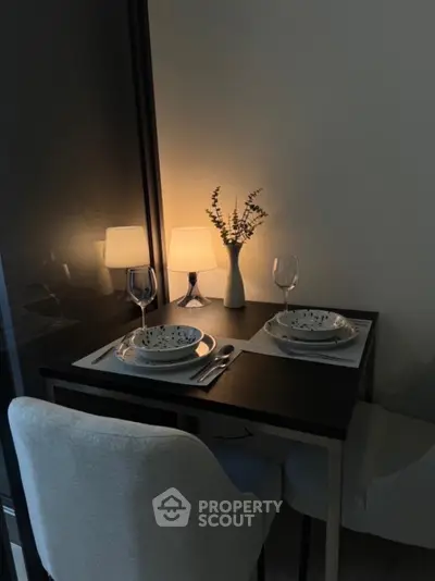 Cozy dining nook with elegant table setting and ambient lighting