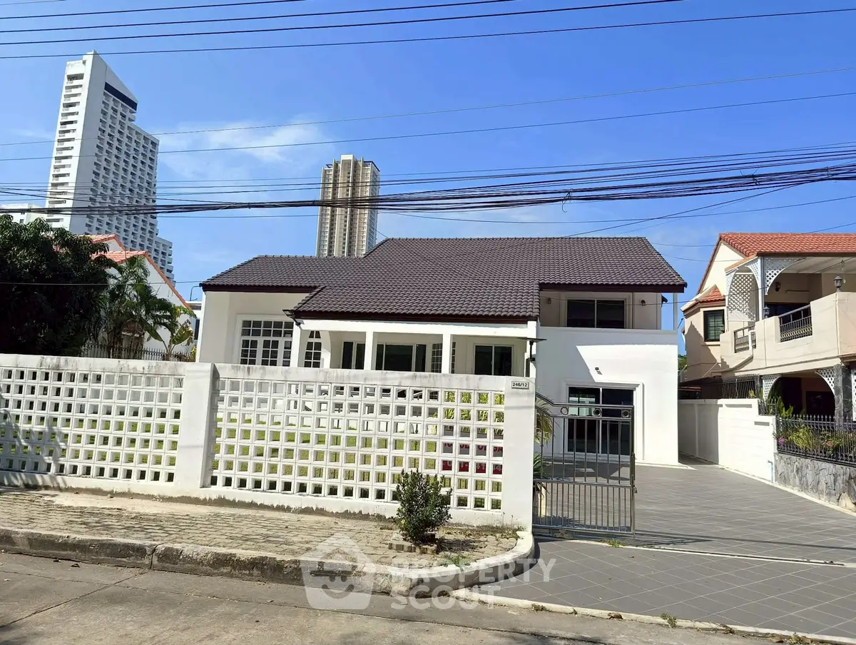 Charming suburban house with modern architecture and spacious driveway, perfect for family living.