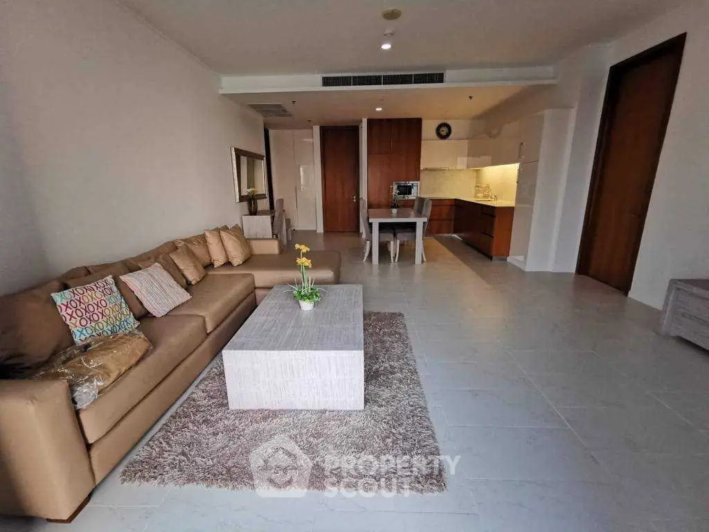 Spacious living room with modern open kitchen in a stylish apartment