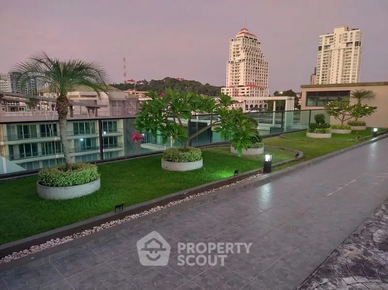Stunning rooftop garden with city skyline views, perfect for relaxation and leisure.