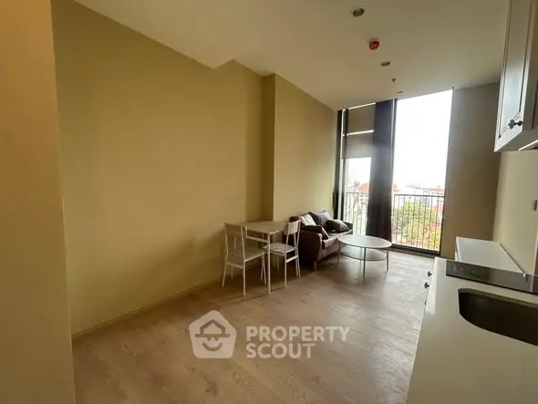 Modern living room with large windows and minimalist furniture, offering a bright and airy atmosphere.