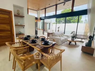 Stunning open-plan living and dining area with modern decor and large windows.