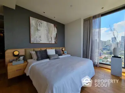 Luxurious bedroom with stunning city view and modern decor