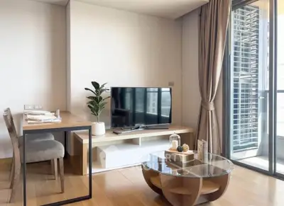 Modern living room with stylish furniture and balcony view