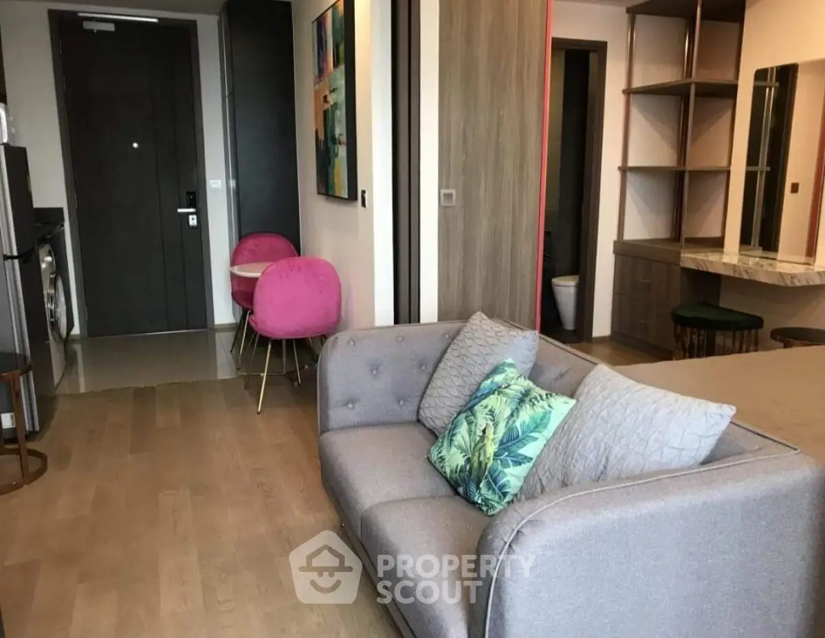 Modern living room with stylish decor and cozy seating area in a contemporary apartment.