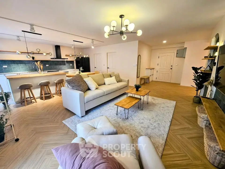 Spacious modern living room with open kitchen and stylish decor