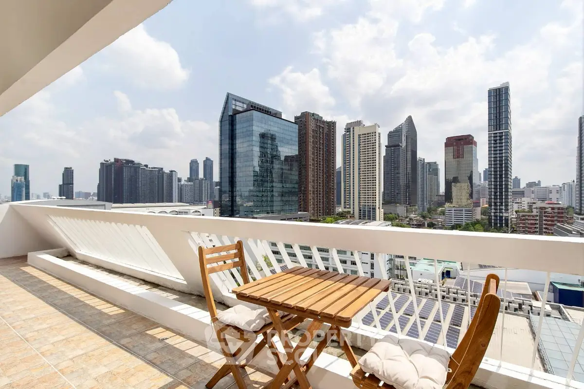 Stunning city view from spacious balcony with modern skyline backdrop.