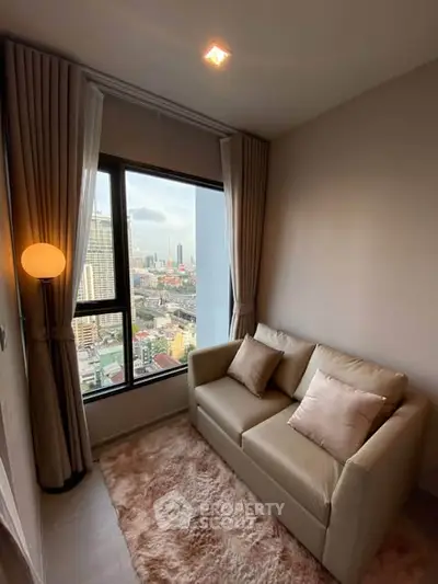 Cozy living room with city view, featuring a plush sofa and elegant curtains.