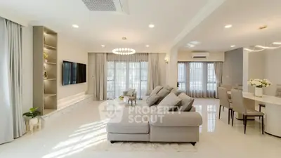 Spacious modern living room with elegant decor and ample natural light