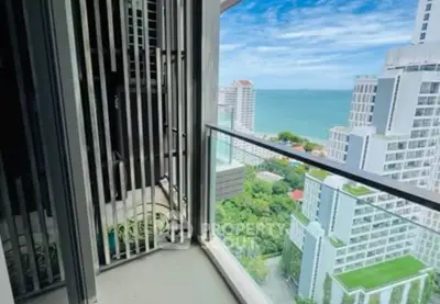Stunning high-rise balcony with breathtaking ocean view and modern cityscape.