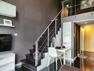 Modern duplex apartment with sleek staircase and stylish decor