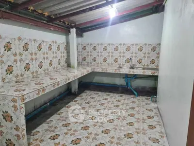 Spacious kitchen with unique floral tile design and ample counter space