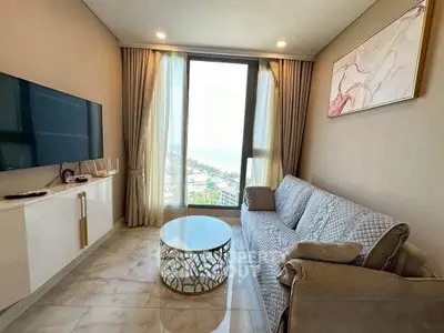 Modern living room with elegant decor and stunning view through large window.