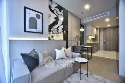 Modern living room with stylish decor and open kitchen layout