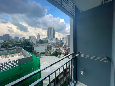 Urban balcony view with city skyline and modern architecture