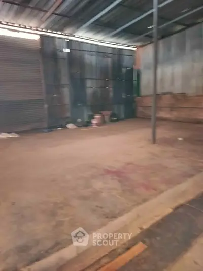 Spacious industrial warehouse space with high ceilings and ample storage potential.