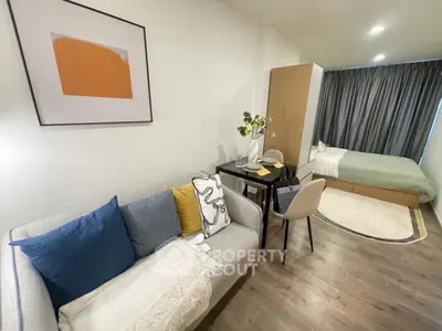Modern studio apartment with cozy living area and stylish decor