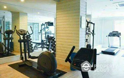 Modern gym with exercise equipment in a bright fitness room