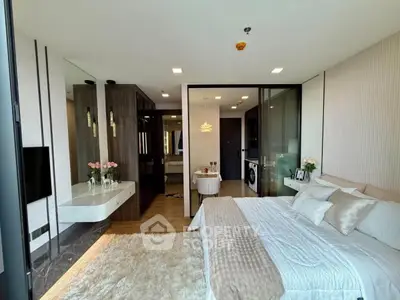 Luxurious bedroom with ensuite bathroom and modern decor in a high-end apartment.