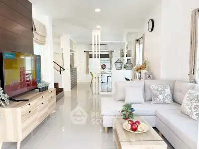 Spacious modern living room with elegant decor and open layout, perfect for family gatherings.