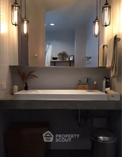 Modern bathroom with stylish lighting and sleek vanity design