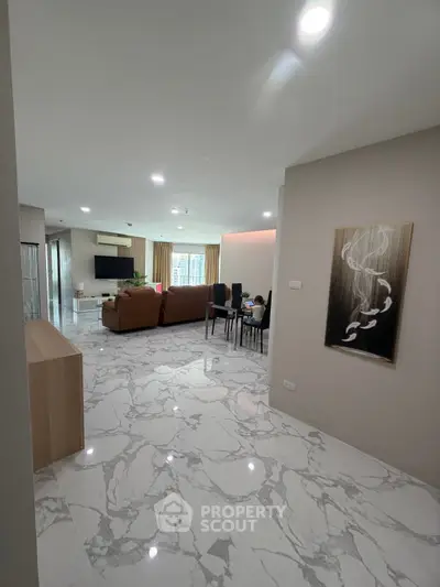 Spacious modern living room with marble flooring and elegant decor