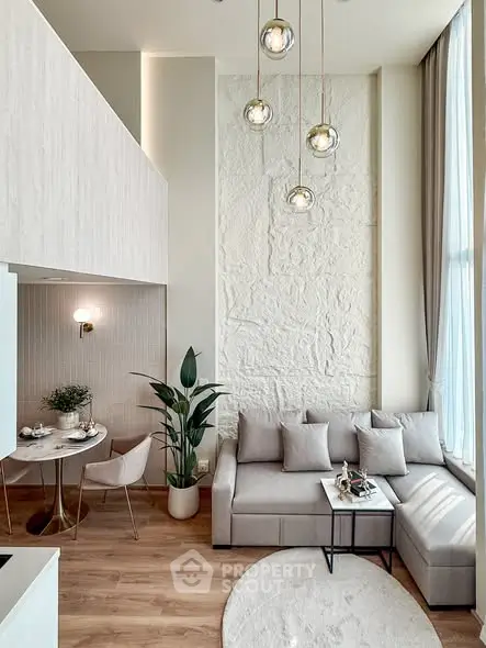 Modern living room with high ceiling and elegant decor