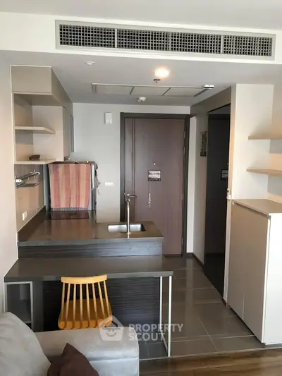 Modern apartment interior with open kitchen and stylish furniture
