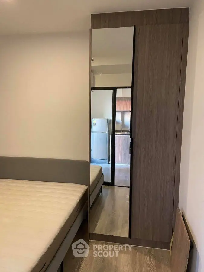 Modern bedroom with mirrored wardrobe and sleek design