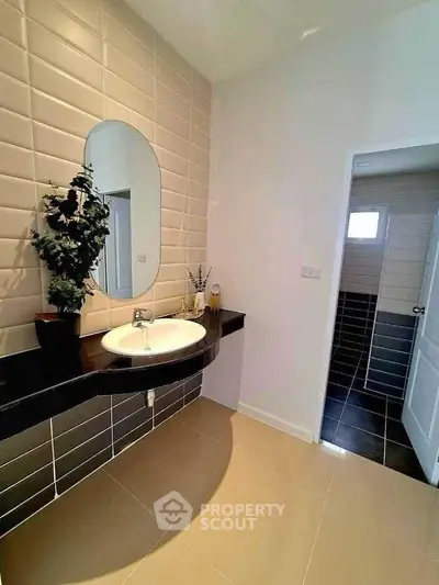 Modern bathroom with stylish sink and elegant tile design