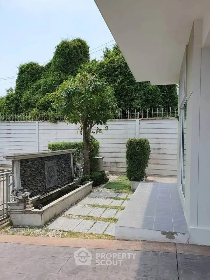 Charming garden view with modern exterior, perfect for relaxation and outdoor enjoyment.