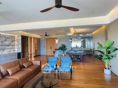 Spacious modern living room with pool table and elegant decor