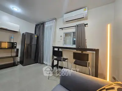 Modern apartment interior with sleek kitchen and dining area