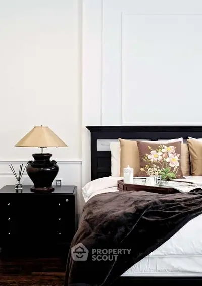 Elegant bedroom with stylish decor and cozy bedding