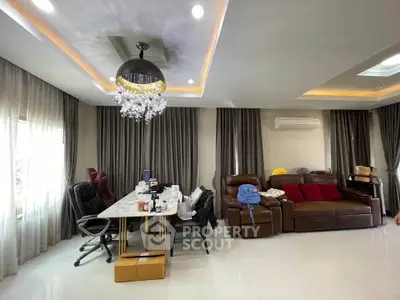 Luxurious living room with elegant chandelier and modern furnishings
