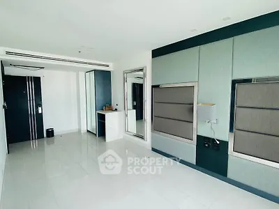 Modern minimalist living room with sleek design and ample natural light