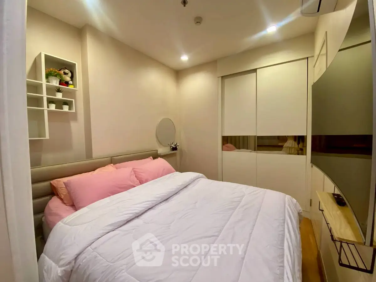 Cozy bedroom with modern decor and ample storage space