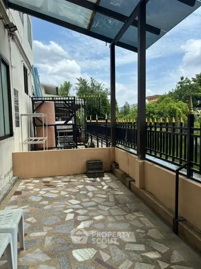 Spacious outdoor balcony with tiled flooring and scenic views, perfect for relaxation and entertainment.