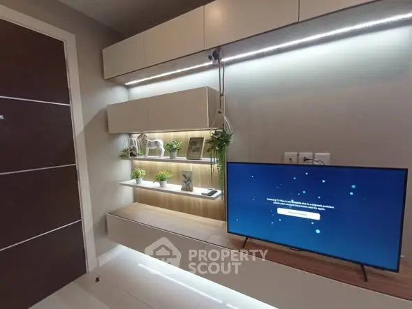 Modern living room with sleek TV unit and ambient lighting