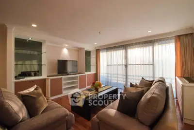 Spacious living room with elegant decor and natural light