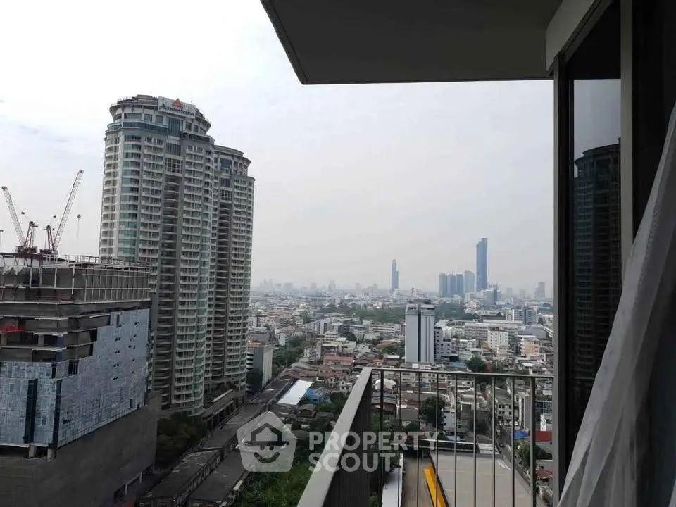 Stunning cityscape view from a modern apartment balcony, showcasing urban living at its finest.