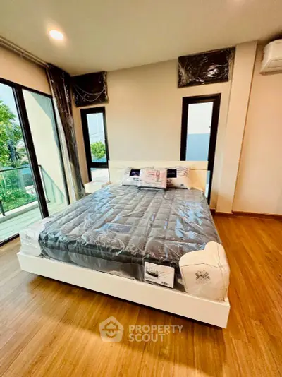 Modern bedroom with large windows and stylish decor in a contemporary home