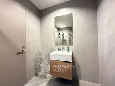 Modern bathroom with sleek design and wall-mounted sink