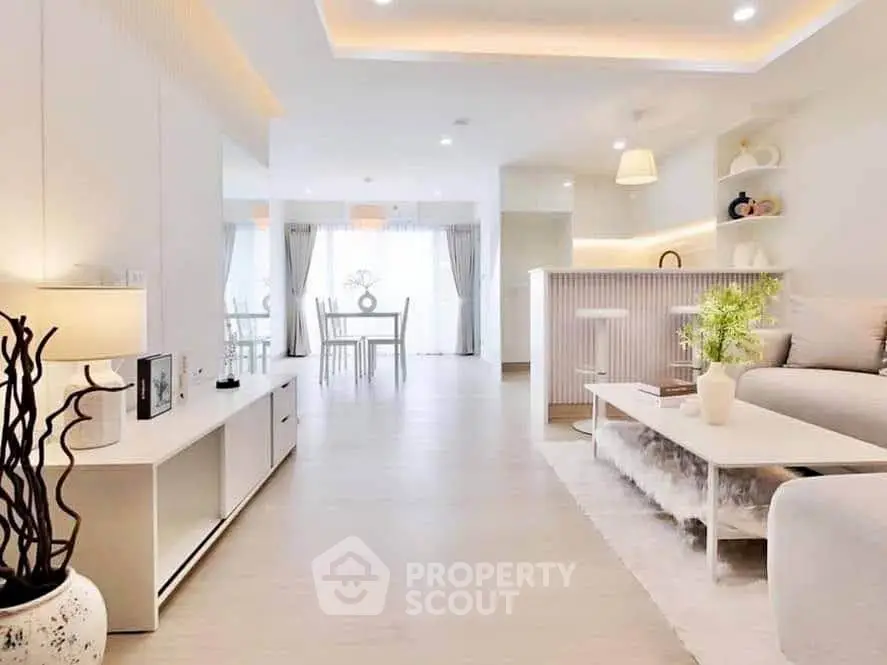 Spacious modern living room with elegant decor and open layout, perfect for entertaining.