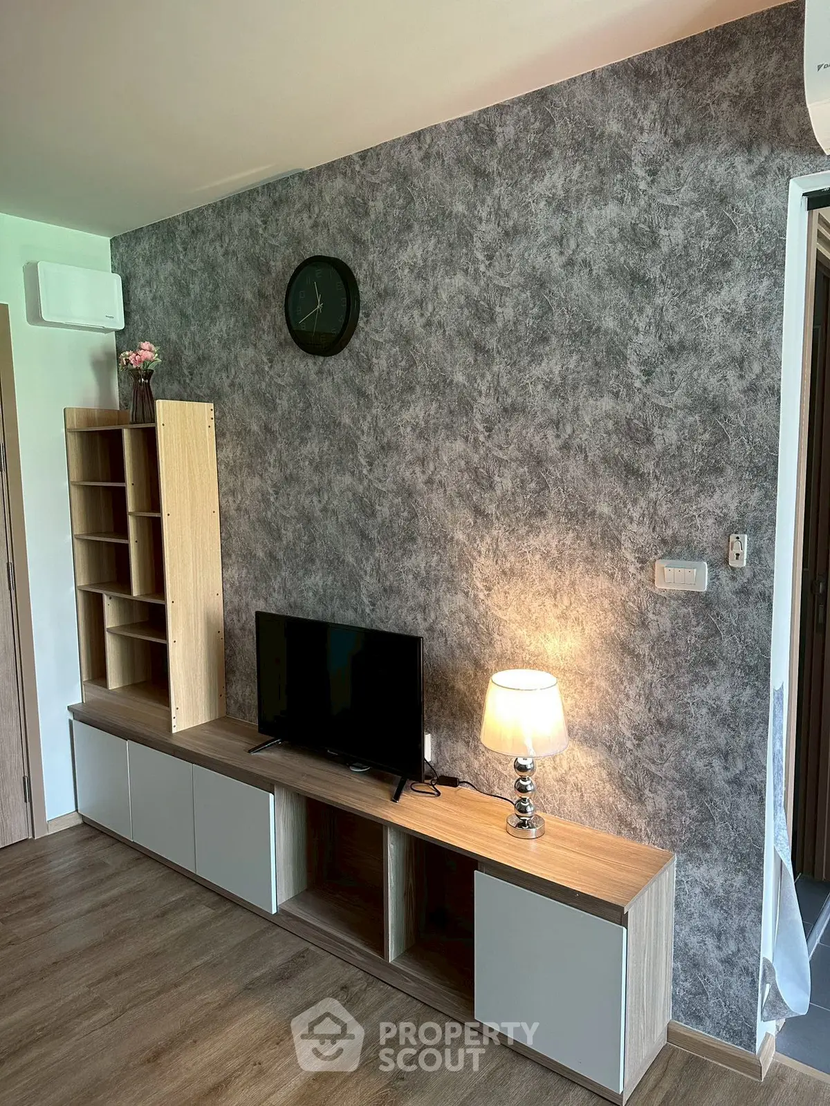 Modern living room with stylish TV stand and elegant wall decor