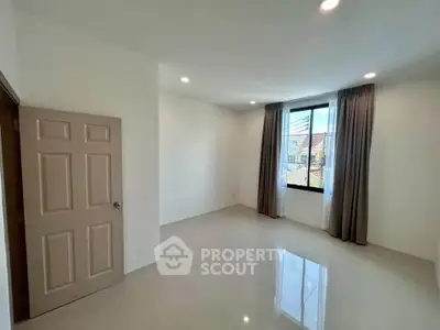 Spacious empty room with large window and glossy floor tiles, perfect for customization.