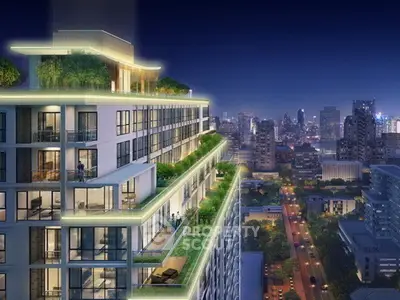 Luxurious high-rise building with stunning city views and spacious balconies at night.